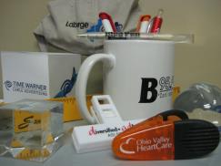 Promotional Products Advertising Specialties mugs pens magnets clips pads 